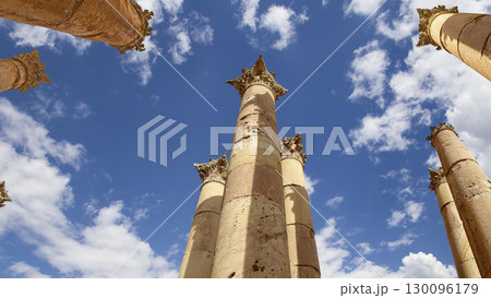 Roman Columns in the Jordanian city of Jerash (Gerasa of Antiquity), capital and largest city of Jerash Governorate, Jordan. Against the background of a beautiful sky with clouds Roman Columns in the Jordanian city of Jerash (Gerasa of Antiquity), capital and largest city of Jerash Governorate, Jordan. Against the background of a beautiful sky with clouds 130096179
