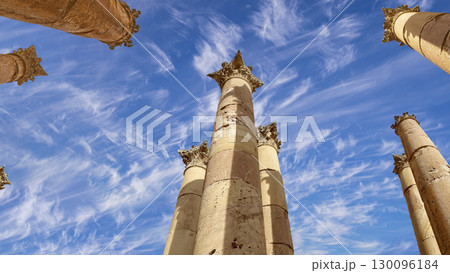 Roman Columns in the Jordanian city of Jerash (Gerasa of Antiquity), capital and largest city of Jerash Governorate, Jordan. Against the background of a beautiful sky with clouds 130096184