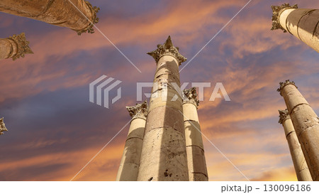 Roman Columns in the Jordanian city of Jerash (Gerasa of Antiquity), capital and largest city of Jerash Governorate, Jordan. Against the background of a beautiful sky with clouds 130096186