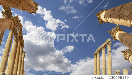 Roman Columns in the Jordanian city of Jerash (Gerasa of Antiquity), capital and largest city of Jerash Governorate, Jordan. Against the background of a beautiful sky with clouds 130096189