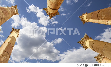Roman Columns in the Jordanian city of Jerash (Gerasa of Antiquity), capital and largest city of Jerash Governorate, Jordan. Against the background of a beautiful sky with clouds Roman Columns in the Jordanian city of Jerash (Gerasa of Antiquity), capital and largest city of Jerash Governorate, Jordan. Against the background of a beautiful sky with clouds 130096200