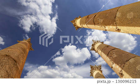 Roman Columns in the Jordanian city of Jerash (Gerasa of Antiquity), capital and largest city of Jerash Governorate, Jordan. Against the background of a beautiful sky with clouds 130096215