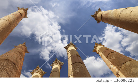 Roman Columns in the Jordanian city of Jerash (Gerasa of Antiquity), capital and largest city of Jerash Governorate, Jordan. Against the background of a beautiful sky with clouds Roman Columns in the Jordanian city of Jerash (Gerasa of Antiquity), capital and largest city of Jerash Governorate, Jordan. Against the background of a beautiful sky with clouds 130096225