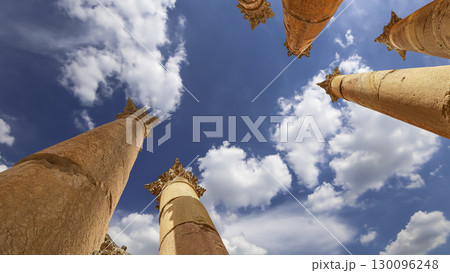Roman Columns in the Jordanian city of Jerash (Gerasa of Antiquity), capital and largest city of Jerash Governorate, Jordan. Against the background of a beautiful sky with clouds 130096248