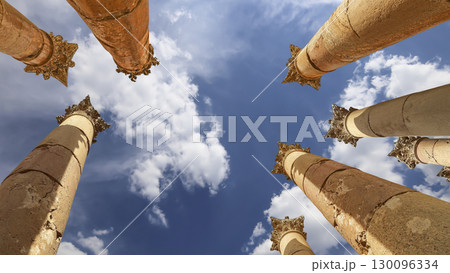 Roman Columns in the Jordanian city of Jerash (Gerasa of Antiquity), capital and largest city of Jerash Governorate, Jordan. Against the background of a beautiful sky with clouds Roman Columns in the Jordanian city of Jerash (Gerasa of Antiquity), capital and largest city of Jerash Governorate, Jordan. Against the background of a beautiful sky with clouds 130096334