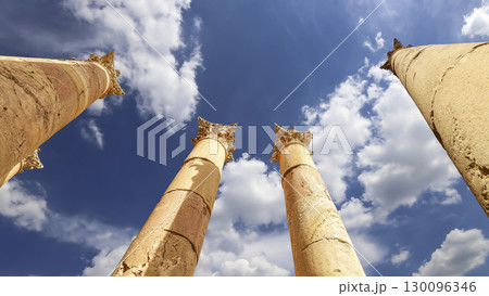Roman Columns in the Jordanian city of Jerash (Gerasa of Antiquity), capital and largest city of Jerash Governorate, Jordan. Against the background of a beautiful sky with clouds Roman Columns in the Jordanian city of Jerash (Gerasa of Antiquity), capital and largest city of Jerash Governorate, Jordan. Against the background of a beautiful sky with clouds 130096346
