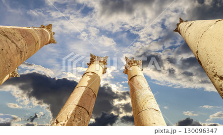 Roman Columns in the Jordanian city of Jerash (Gerasa of Antiquity), capital and largest city of Jerash Governorate, Jordan. Against the background of a beautiful sky with clouds Roman Columns in the Jordanian city of Jerash (Gerasa of Antiquity), capital and largest city of Jerash Governorate, Jordan. Against the background of a beautiful sky with clouds 130096347