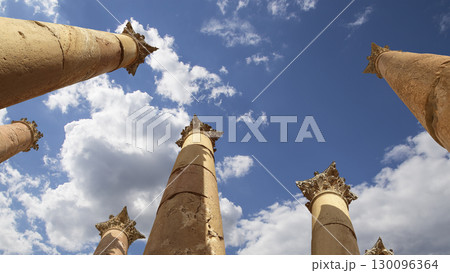 Roman Columns in the Jordanian city of Jerash (Gerasa of Antiquity), capital and largest city of Jerash Governorate, Jordan. Against the background of a beautiful sky with clouds 130096364