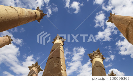 Roman Columns in the Jordanian city of Jerash (Gerasa of Antiquity), capital and largest city of Jerash Governorate, Jordan. Against the background of a beautiful sky with clouds Roman Columns in the Jordanian city of Jerash (Gerasa of Antiquity), capital and largest city of Jerash Governorate, Jordan. Against the background of a beautiful sky with clouds 130096365