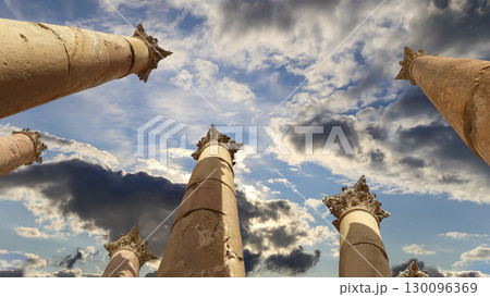 Roman Columns in the Jordanian city of Jerash (Gerasa of Antiquity), capital and largest city of Jerash Governorate, Jordan. Against the background of a beautiful sky with clouds 130096369