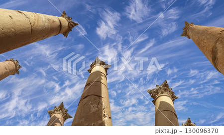 Roman Columns in the Jordanian city of Jerash (Gerasa of Antiquity), capital and largest city of Jerash Governorate, Jordan. Against the background of a beautiful sky with clouds 130096370