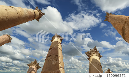 Roman Columns in the Jordanian city of Jerash (Gerasa of Antiquity), capital and largest city of Jerash Governorate, Jordan. Against the background of a beautiful sky with clouds 130096371