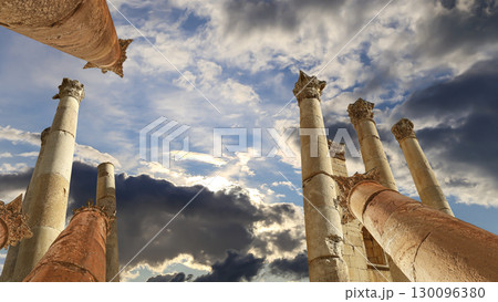 Roman Columns in the Jordanian city of Jerash (Gerasa of Antiquity), capital and largest city of Jerash Governorate, Jordan. Against the background of a beautiful sky with clouds Roman Columns in the Jordanian city of Jerash (Gerasa of Antiquity), capital and largest city of Jerash Governorate, Jordan. Against the background of a beautiful sky with clouds 130096380