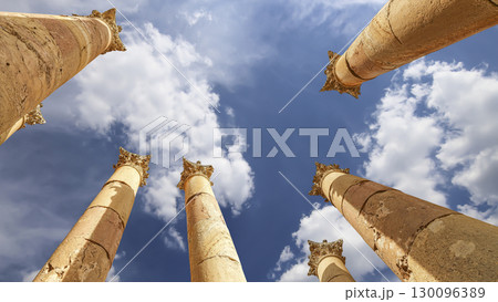 Roman Columns in the Jordanian city of Jerash (Gerasa of Antiquity), capital and largest city of Jerash Governorate, Jordan. Against the background of a beautiful sky with clouds Roman Columns in the Jordanian city of Jerash (Gerasa of Antiquity), capital and largest city of Jerash Governorate, Jordan. Against the background of a beautiful sky with clouds 130096389