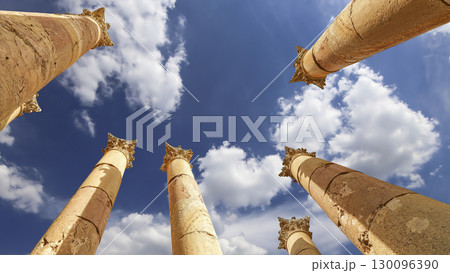 Roman Columns in the Jordanian city of Jerash (Gerasa of Antiquity), capital and largest city of Jerash Governorate, Jordan. Against the background of a beautiful sky with clouds 130096390