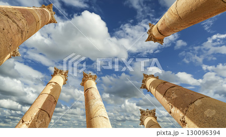 Roman Columns in the Jordanian city of Jerash (Gerasa of Antiquity), capital and largest city of Jerash Governorate, Jordan. Against the background of a beautiful sky with clouds Roman Columns in the Jordanian city of Jerash (Gerasa of Antiquity), capital and largest city of Jerash Governorate, Jordan. Against the background of a beautiful sky with clouds 130096394