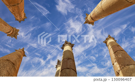 Roman Columns in the Jordanian city of Jerash (Gerasa of Antiquity), capital and largest city of Jerash Governorate, Jordan. Against the background of a beautiful sky with clouds 130096407