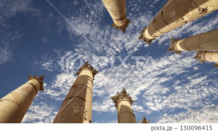 Roman Columns in the Jordanian city of Jerash (Gerasa of Antiquity), capital and largest city of Jerash Governorate, Jordan. Against the background of a beautiful sky with clouds Roman Columns in the Jordanian city of Jerash (Gerasa of Antiquity), capital and largest city of Jerash Governorate, Jordan. Against the background of a beautiful sky with clouds 130096415