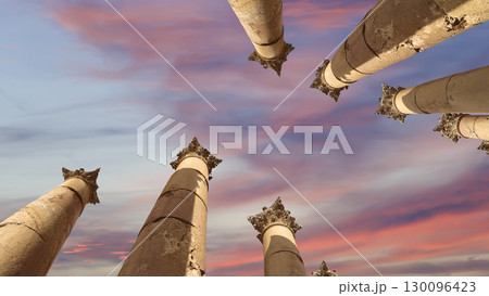 Roman Columns in the Jordanian city of Jerash (Gerasa of Antiquity), capital and largest city of Jerash Governorate, Jordan. Against the background of a beautiful sky with clouds Roman Columns in the Jordanian city of Jerash (Gerasa of Antiquity), capital and largest city of Jerash Governorate, Jordan. Against the background of a beautiful sky with clouds 130096423