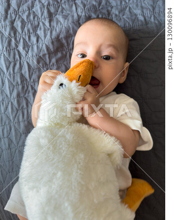 Baby Smiling with Plush Duck Toy 130096894