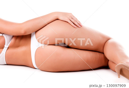 Sexy female ass, isolated on a white background 130097909