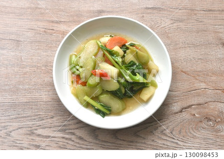 fried Kailaan Chinese kale and carrot dressing oyster sauce on plate 130098453