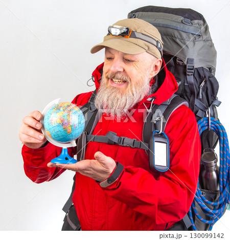 An elderly man with a white beard, wearing a red jacket and beige cap with a headlamp An elderly man with a white beard, wearing a red jacket and beige cap with a headlamp 130099142