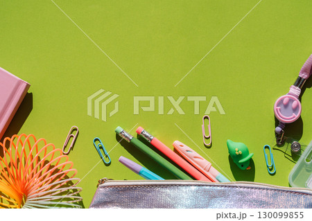 Flat lay of back to school stationery with green background Flat lay of back to school stationery with green background 130099855