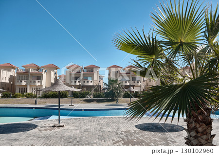 Residential Complex with Pool and Palm Trees Residential Complex with Pool and Palm Trees 130102960