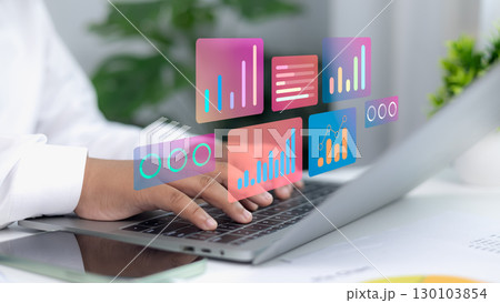 Businessman using laptop with digital data analytics dashboard, futuristic business technology concept Businessman using laptop with digital data analytics dashboard, futuristic business technology concept 130103854