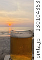 glass of beer on the beach 130104353