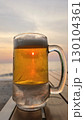 glass of beer on the beach 130104361