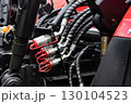 Close-up of hydraulic hoses and connectors on machinery equipment. 130104523