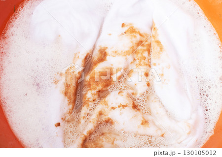 Soaking stained white clothes in detergent for laundry and hygiene Soaking stained white clothes in detergent for laundry and hygiene 130105012