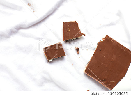 Milk chocolate bar depicting concept of laundry or dirtiness Milk chocolate bar depicting concept of laundry or dirtiness 130105025