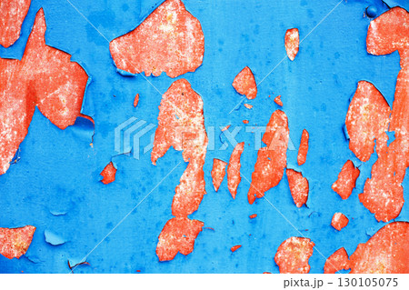Old blue paint peeling from red concrete wall texture background. 130105075