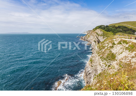 Lulworth Cove limestone cliffs above the English Channel, Dorset Jurassic Coast seascape 130106898