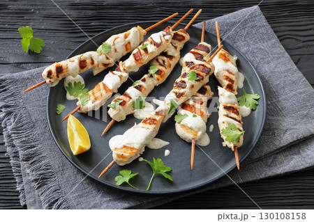 Greek style grilled chicken souvlaki on a plate Greek style grilled chicken souvlaki on a plate 130108158