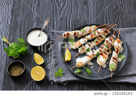 Greek style grilled chicken souvlaki on a plate Greek style grilled chicken souvlaki on a plate 130108163