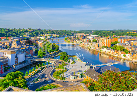 Namur cityscape with confluence of Sambre and Meuse rivers with bridges, aerial panoramic view of Namur city, skyline horizon with green forests trees on hills, Wallonia, Walloon Region, Belgium 130108322