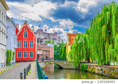 Ghent cityscape, embankment promenade of Lieve water canal, old brick buildings, Ghent historical city centre Prinsenhof Princes Court, Castle of the Counts in Gent old town, Flemish Region, Belgium 130108405