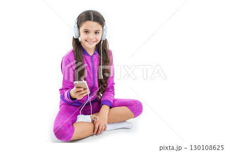 photo of teen girl use music app on phone, banner. teen girl use music app isolated on white. 130108625