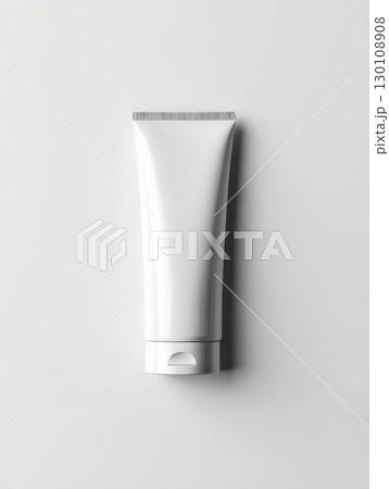 A plain white tube with a flip cap, used for creams or lotions, against a light gray background. 130108908