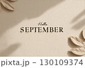 The image features the words 'Hello September' on a textured beige background with shadows and leaves around the edges. 130109374