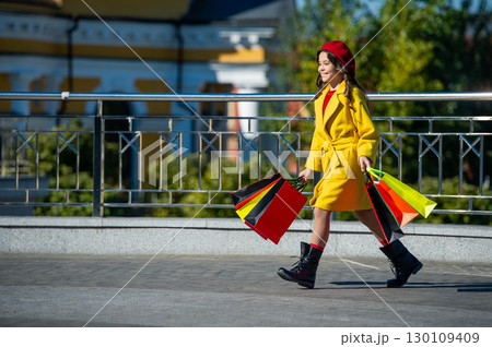 teen girl hold shopping bag at autumn sale and discount copy space teen girl hold shopping bag at autumn sale and discount copy space 130109409