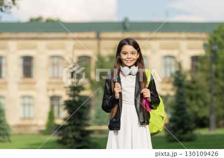 School education. Adolescence lifestyle. Teen girl school student outdoor. Advertisement. Student life. Listen to music in headphones. Teen girl generation. Lifestyle and education. Back to school School education. Adolescence lifestyle. Teen girl school student outdoor. Advertisement. Student life. Listen to music in headphones. Teen girl generation. Lifestyle and education. Back to school 130109426