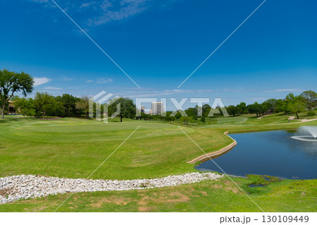 scenery meadow and lake in outdoor park. landscape of nature. scenic landscape view of nature in park with green grass. park with nature landscape 130109449
