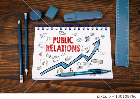 Public Relations Strategy with Doodles and Growth Arrow on Notepad in Office Environment 130109766