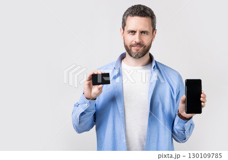 photo of man paying transaction, copy space. man paying transaction 130109785