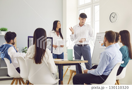 Business people sitting in modern office with colleagues on work conference. Teamwork concept Business people sitting in modern office with colleagues on work conference. Teamwork concept 130110320